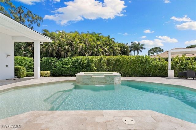 2274 Hawksridge Dr, Naples, FL 34105 - view of swimming pool featuring a pool with connected hot tub and a patio