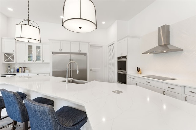 2274 Hawksridge Dr, Naples, FL 34105 - kitchen with island exhaust hood, stainless steel appliances, tasteful backsplash, white cabinetry, and glass insert cabinets