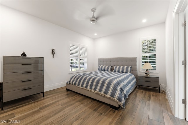 2274 Hawksridge Dr, Naples, FL 34105 - bedroom featuring multiple windows, wood finished floors, ceiling fan, and recessed lighting