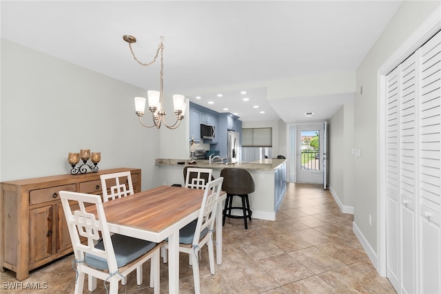 919 Huron Ct Unit B203, Marco Island, FL 34145 - dining space featuring a chandelier, light tile patterned flooring, and recessed lighting