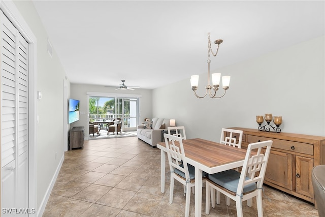 919 Huron Ct Unit B203, Marco Island, FL 34145 - dining space featuring a chandelier, a ceiling fan, and light tile patterned floors