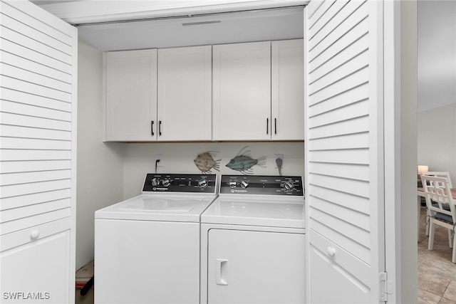 919 Huron Ct Unit B203, Marco Island, FL 34145 - washroom with washing machine and dryer and cabinet space