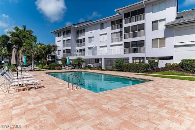919 Huron Ct Unit B203, Marco Island, FL 34145 - community pool featuring a patio