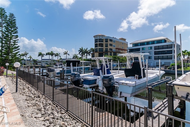 919 Huron Ct Unit B203, Marco Island, FL 34145 - dock featuring boat lift and a water view