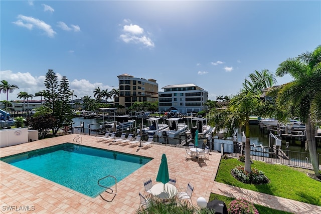 919 Huron Ct Unit B203, Marco Island, FL 34145 - community pool featuring a water view and a patio