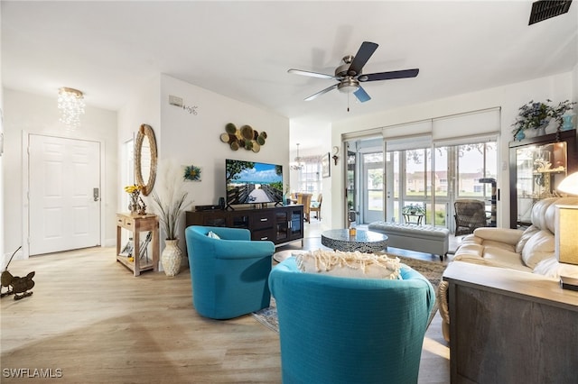 15050 Lakeside View Dr Unit 1001, Fort Myers, FL 33919 - living room with wood finished floors, a chandelier, and ceiling fan