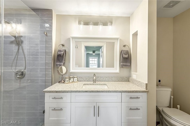 2806 22nd St W, Lehigh Acres, FL 33971 - full bathroom featuring vanity, tiled shower, and a ceiling fan