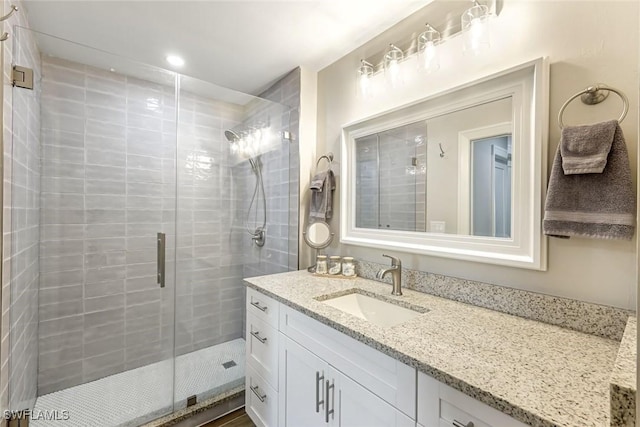 2806 22nd St W, Lehigh Acres, FL 33971 - bathroom featuring vanity, a stall shower, and recessed lighting