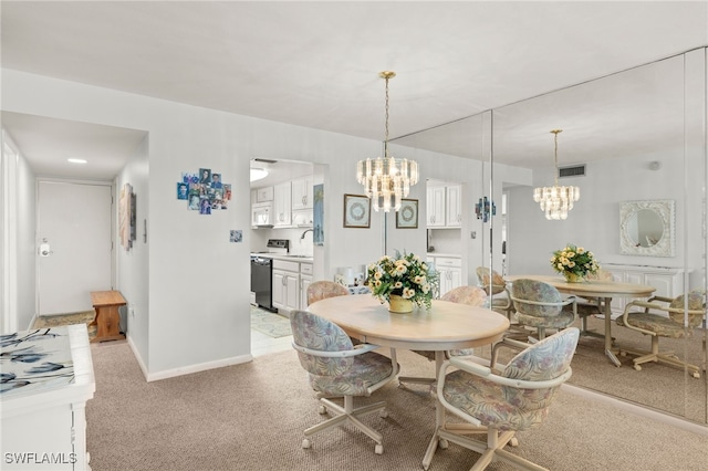 7400 Estero Blvd Unit 629, Fort Myers Beach, FL 33931 - dining space featuring a chandelier and light colored carpet
