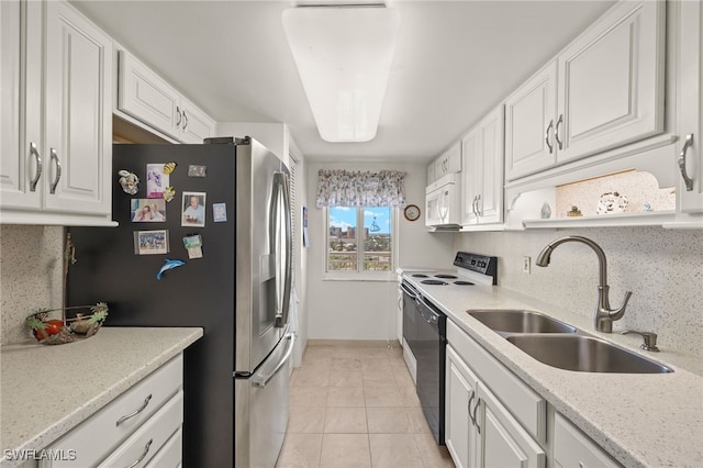 7400 Estero Blvd Unit 629, Fort Myers Beach, FL 33931 - kitchen with stainless steel fridge, white cabinets, light tile patterned floors, and decorative backsplash