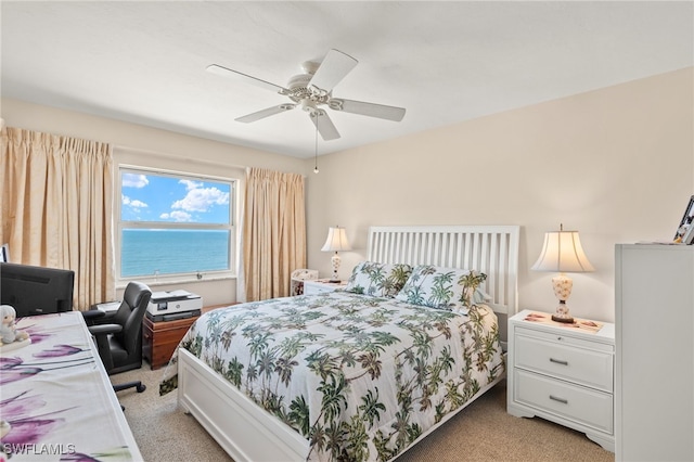 7400 Estero Blvd Unit 629, Fort Myers Beach, FL 33931 - bedroom with light colored carpet, a desk, and a ceiling fan
