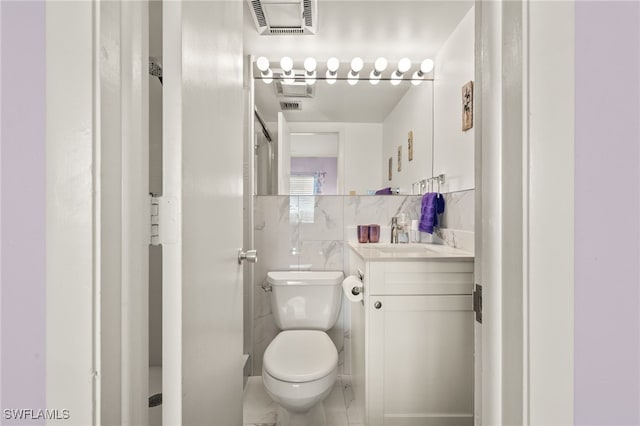 7400 Estero Blvd Unit 629, Fort Myers Beach, FL 33931 - bathroom featuring tile walls, vanity, and a shower
