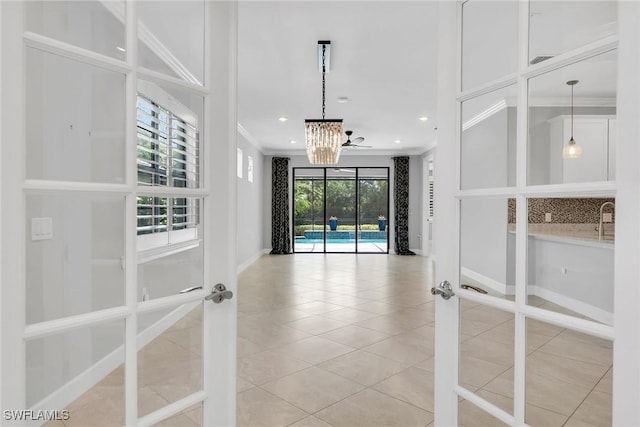 7690 Jacaranda Ln, Naples, FL 34114 - empty room with a chandelier, crown molding, tile patterned floors, french doors, and recessed lighting