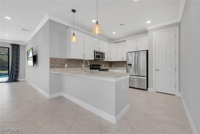 7690 Jacaranda Ln, Naples, FL 34114 - kitchen featuring appliances with stainless steel finishes, crown molding, a peninsula, decorative backsplash, and light tile patterned floors