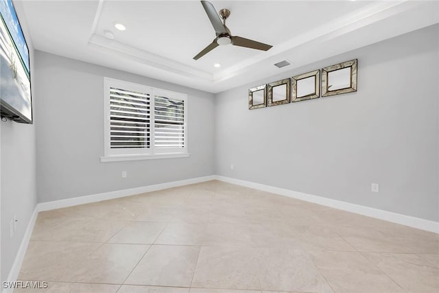 7690 Jacaranda Ln, Naples, FL 34114 - empty room featuring a raised ceiling, ceiling fan, recessed lighting, and light tile patterned floors