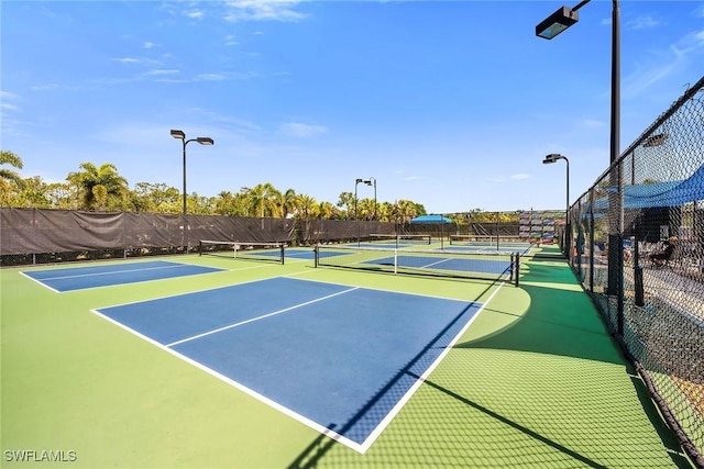 7690 Jacaranda Ln, Naples, FL 34114 - view of tennis court featuring community basketball court