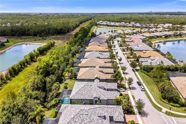 7690 Jacaranda Ln, Naples, FL 34114 - aerial perspective of suburban area with a nearby body of water
