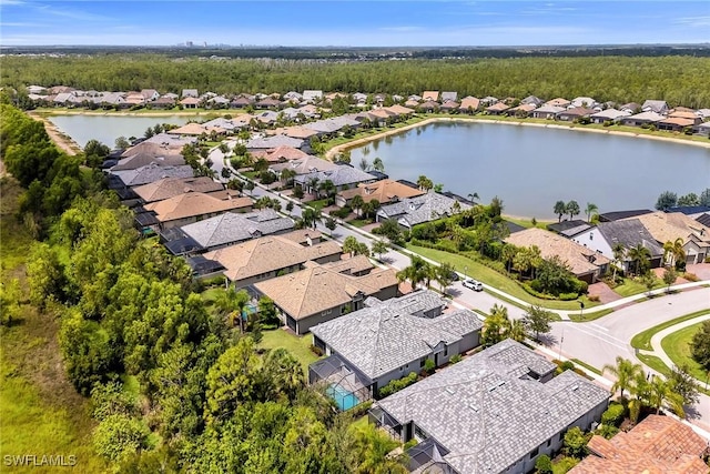 7690 Jacaranda Ln, Naples, FL 34114 - aerial perspective of suburban area with a nearby body of water
