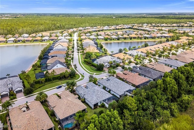 7690 Jacaranda Ln, Naples, FL 34114 - aerial perspective of suburban area with a large body of water and a forest