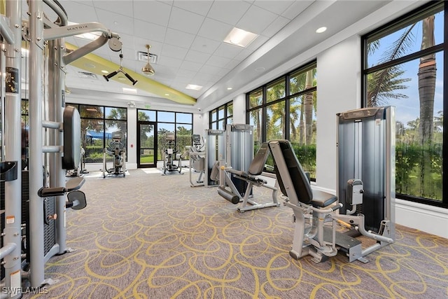 7690 Jacaranda Ln, Naples, FL 34114 - gym with carpet floors and recessed lighting