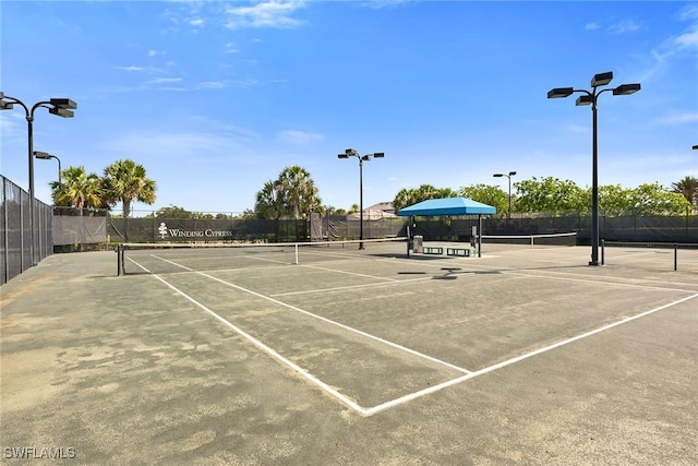7690 Jacaranda Ln, Naples, FL 34114 - view of tennis court with community basketball court