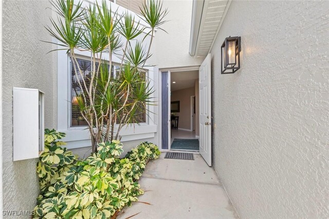 8421 Southbridge Dr Unit 4, Estero, FL 33967 - property entrance featuring stucco siding