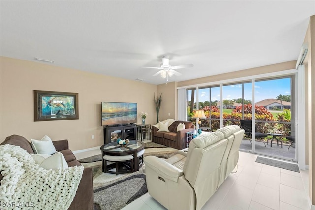 8421 Southbridge Dr Unit 4, Estero, FL 33967 - living area with a ceiling fan and light tile patterned flooring