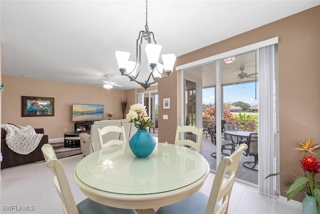 8421 Southbridge Dr Unit 4, Estero, FL 33967 - dining area featuring ceiling fan, a chandelier, and light tile patterned floors