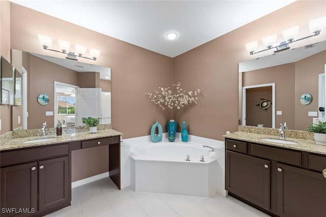 8421 Southbridge Dr Unit 4, Estero, FL 33967 - full bath featuring a bath, two vanities, and tile patterned floors
