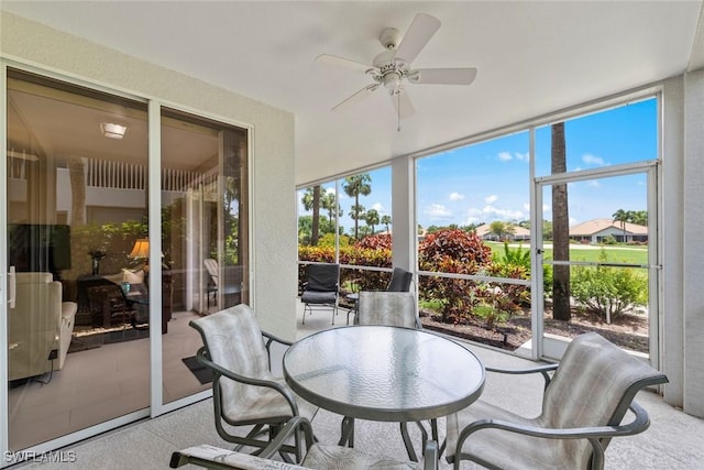 8421 Southbridge Dr Unit 4, Estero, FL 33967 - sunroom / solarium with ceiling fan, outdoor dining space, and expansive windows