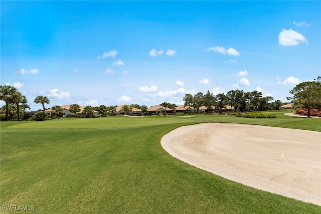 8421 Southbridge Dr Unit 4, Estero, FL 33967 - surrounding community with a residential view, golf course view, and a lawn