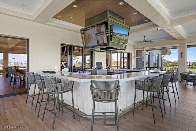 8421 Southbridge Dr Unit 4, Estero, FL 33967 - kitchen with wood finished floors, a ceiling fan, beam ceiling, and coffered ceiling