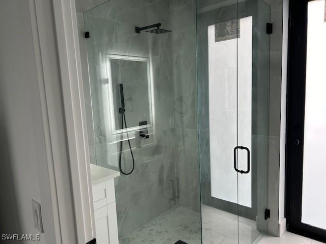 2603 3rd St SW, Lehigh Acres, FL 33976 - bathroom with a marble finish shower