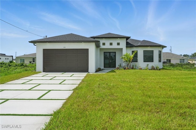 472 Rajah St, Lehigh Acres, FL 33974 - prairie-style home featuring stucco siding, a garage, concrete driveway, and a front yard