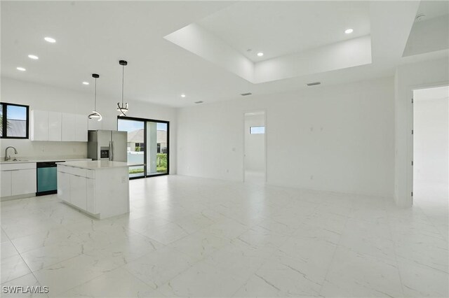 472 Rajah St, Lehigh Acres, FL 33974 - kitchen featuring stainless steel fridge, dishwasher, a center island, modern cabinets, and recessed lighting