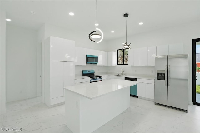 472 Rajah St, Lehigh Acres, FL 33974 - kitchen featuring stainless steel appliances, modern cabinets, light marble finish floors, and recessed lighting
