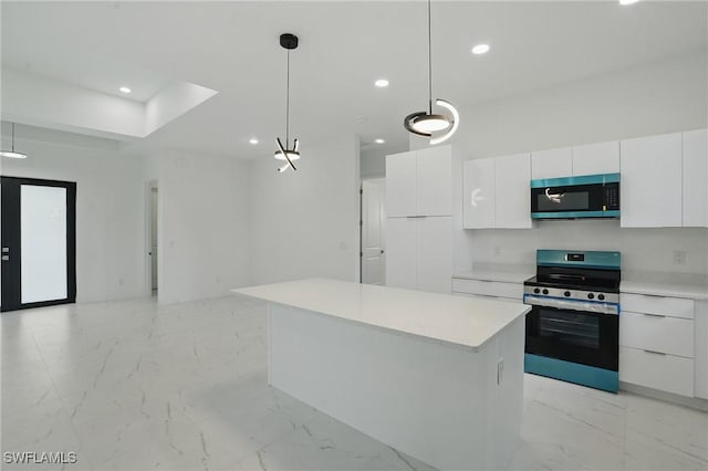 472 Rajah St, Lehigh Acres, FL 33974 - kitchen featuring appliances with stainless steel finishes, recessed lighting, light marble finish floors, white cabinetry, and light countertops