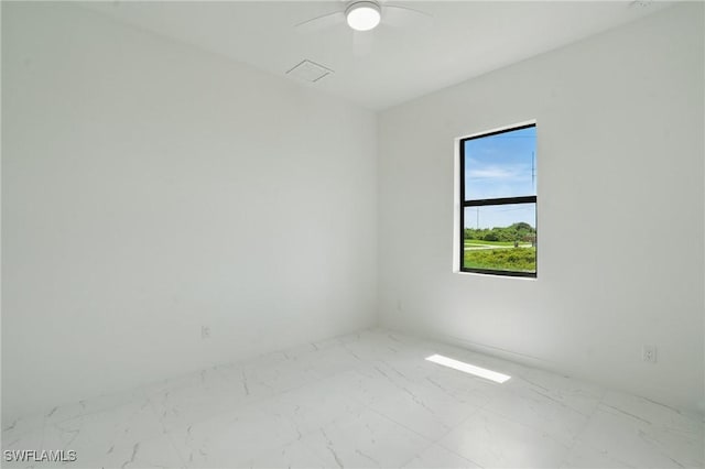 472 Rajah St, Lehigh Acres, FL 33974 - unfurnished room featuring marble finish floors and a ceiling fan