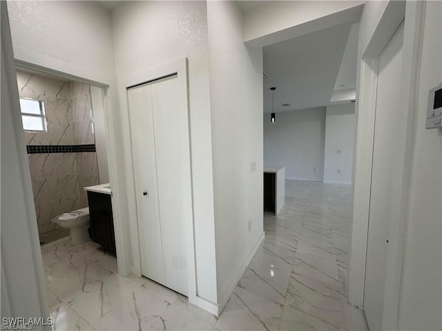 394 Palora Ave, Lehigh Acres, FL 33974 - hallway with light marble finish floors and baseboards