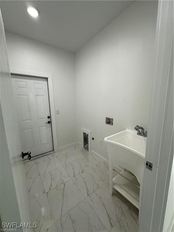 394 Palora Ave, Lehigh Acres, FL 33974 - washroom with hookup for an electric dryer, washer hookup, light marble finish floors, and recessed lighting