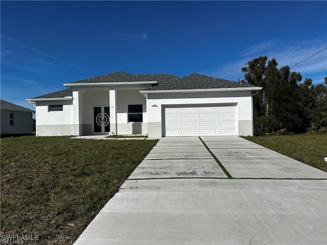394 Palora Ave, Lehigh Acres, FL 33974 - view of front of house with an attached garage, driveway, a front lawn, and stucco siding