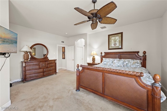 28649 San Lucas Ln Unit 102, Bonita Springs, FL 34135 - bedroom featuring light colored carpet, arched walkways, and a ceiling fan