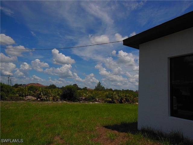 821 Bell Blvd S, Lehigh Acres, FL 33974 - view of grassy yard