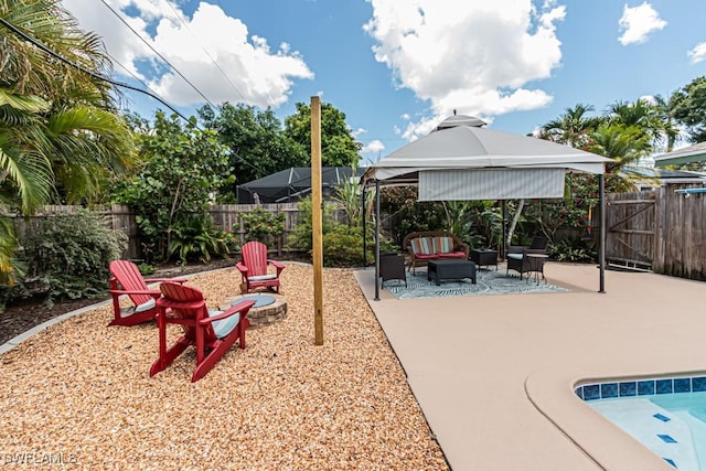 1413 Davis Dr, Fort Myers, FL 33919 - fenced backyard featuring a patio area, an outdoor hangout area, and a gazebo