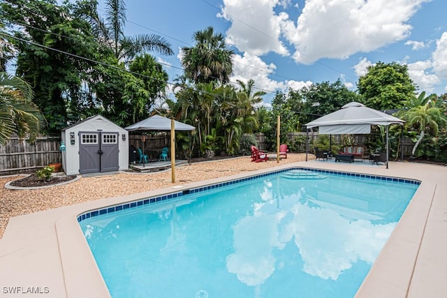 1413 Davis Dr, Fort Myers, FL 33919 - view of swimming pool featuring a gazebo, a shed, a fenced backyard, and a patio
