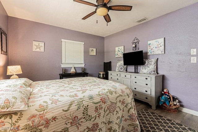 1413 Davis Dr, Fort Myers, FL 33919 - bedroom with dark wood-style floors and a ceiling fan