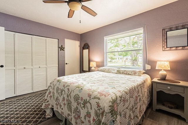 1413 Davis Dr, Fort Myers, FL 33919 - bedroom featuring dark wood finished floors, a closet, a textured wall, and a ceiling fan