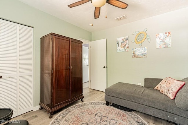 1413 Davis Dr, Fort Myers, FL 33919 - living room with light wood-style floors and a ceiling fan