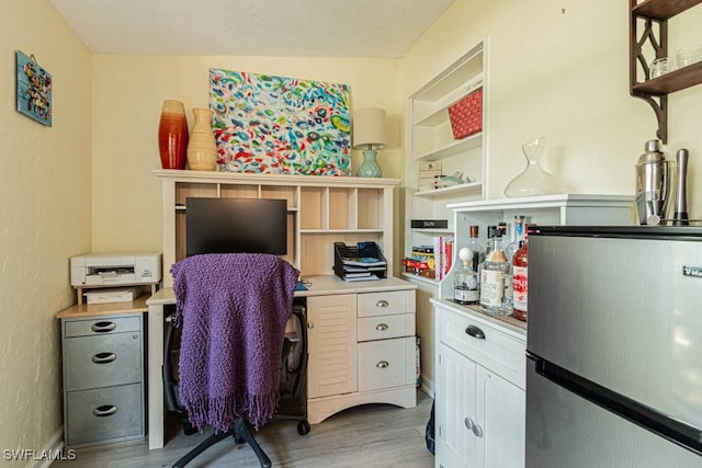1413 Davis Dr, Fort Myers, FL 33919 - office area featuring light wood finished floors and built in shelves