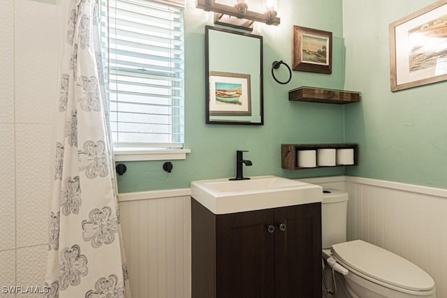 1413 Davis Dr, Fort Myers, FL 33919 - bathroom with wainscoting, vanity, wood walls, and a shower with curtain